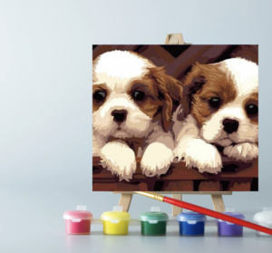 An easel with paints and a paint by number painting on canvas on it