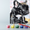 An easel with paints and a canvas on it