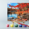 A Autumn Serenity Paint By Number photo on an easel with paint pots and paint brush
