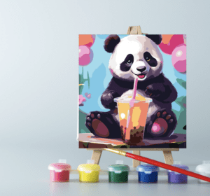 An easel with paints and a Panda with Boba canvas on it