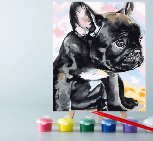 An easel with paints and a canvas on it