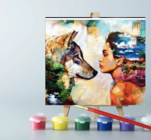 An easel with woman and wolf paint by number canvas on it