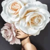 A paint by number painting of a woman with white roses on her head