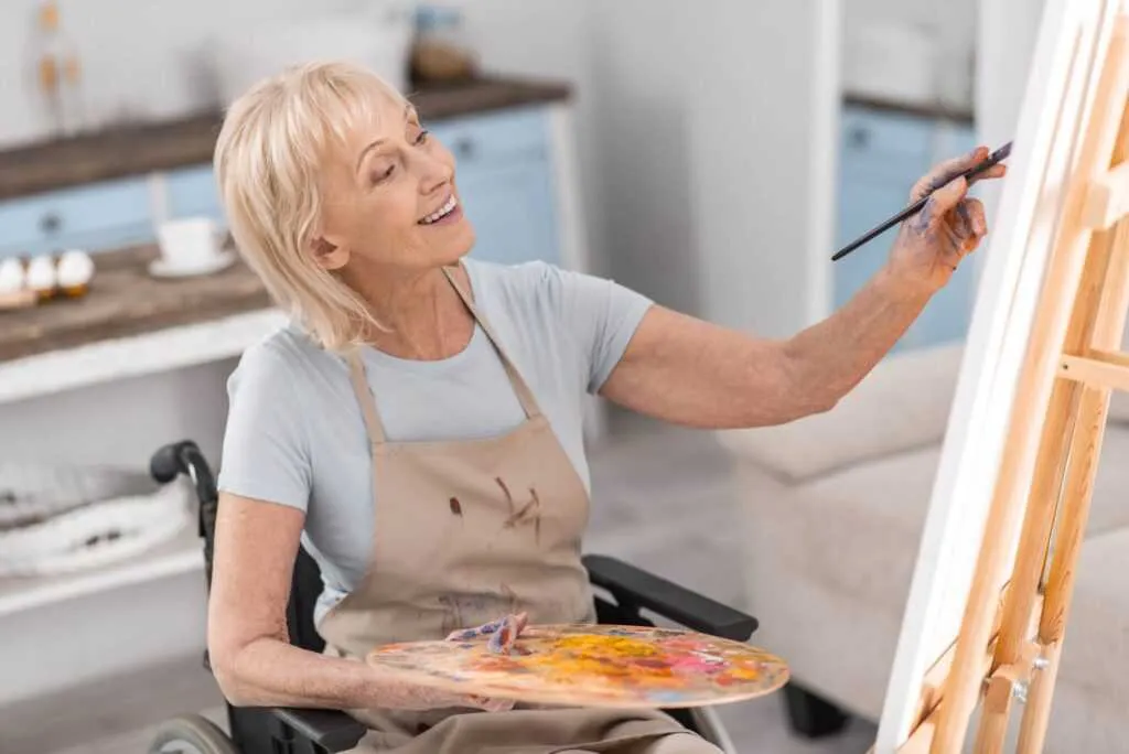 Photo of a woman painting on a canvas
